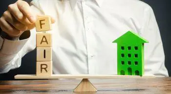 Rent Regulations, wooden blocks with the word Fair and a wooden house showing balance is needed
